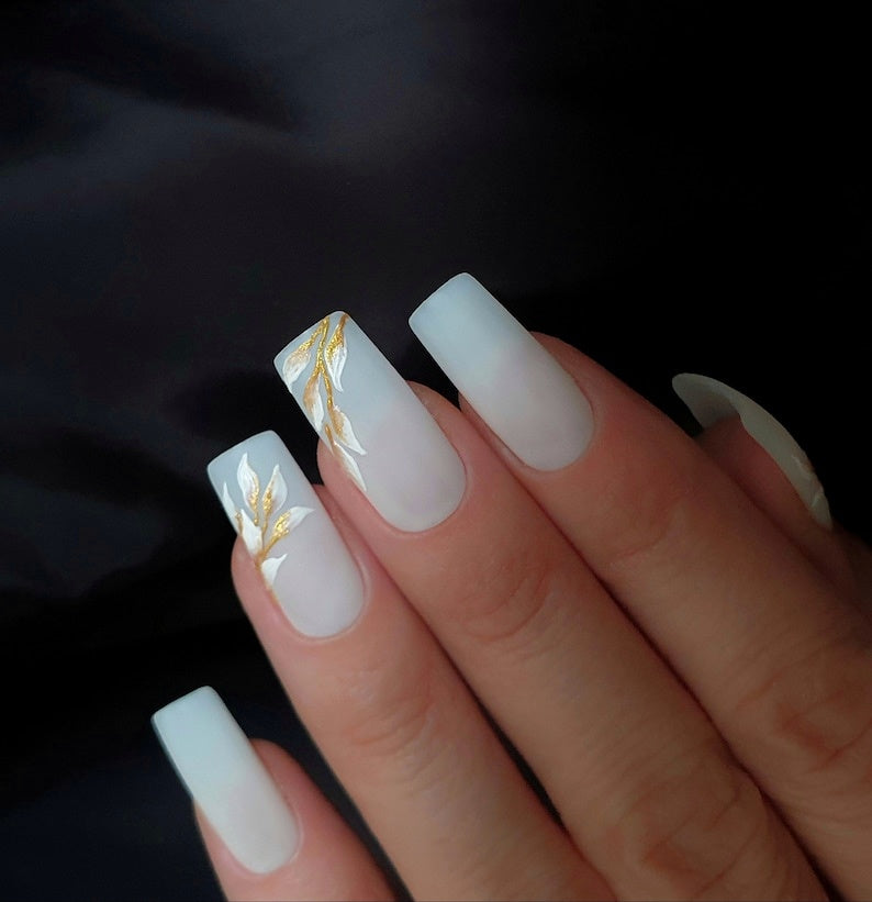 Milky White Matte Nails with a Golden White Floral Design