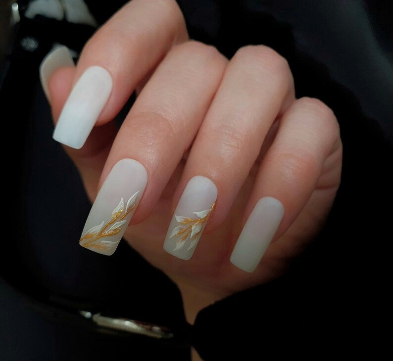 Milky White Matte Nails with a Golden White Floral Design